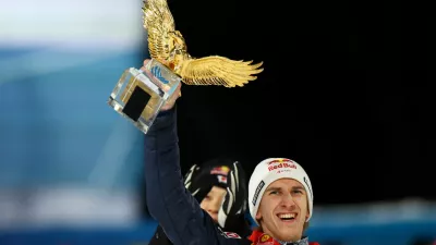 Ski Jumping - Four Hills Tournament - Bischofshofen, Austria - January 6, 2025 Austria's Daniel Tschofenig celebrates winning the Four Hills Tournament with the trophy REUTERS/Lisi Niesner