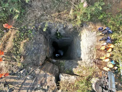 This image provided by Indian Army shows rescue workers standing around a coal mine where at least nine workers are trapped, in Umrangso area of Dimapur Hasao district in northeastern state of Assam, India, Tuesday, Jan. 7, 2025. (Indian Army via AP)