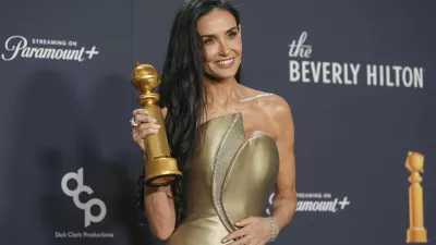 Demi Moore poses in the press room with the award for best performance by a female actor in a motion picture - musical or comedy for "The Substance" during the 82nd Golden Globes on Sunday, Jan. 5, 2025, at the Beverly Hilton in Beverly Hills, Calif. (AP Photo/Chris Pizzello)