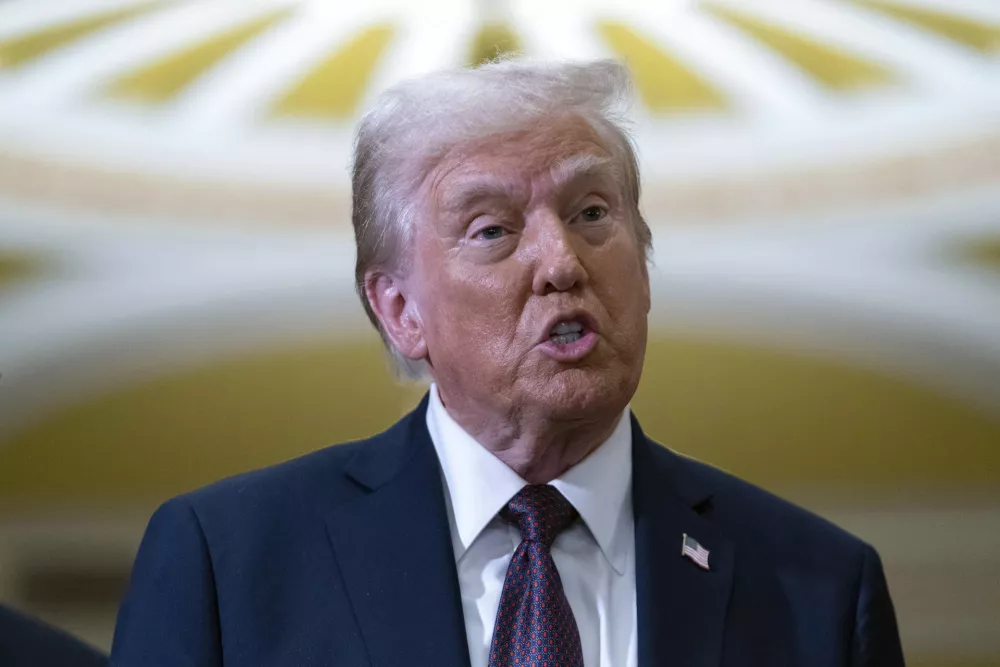 President-elect Donald Trump talks to reporters after a meeting with Republican leadership at the Capitol on Wednesday, Jan. 8, 2025, in Washington. (AP Photo/Jose Luis Magana)