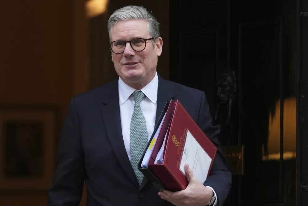 Britain's Prime Minister Keir Starmer leaves 10 Downing Street to attend the weekly session of Prime Ministers Questions in Parliament in London, Wednesday, Jan. 8, 2025. (AP Photo/Kirsty Wigglesworth)