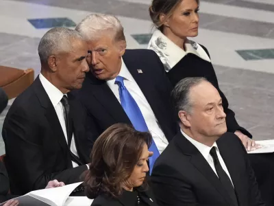 Former President Barack Obama talks with President-elect Donald Trump as Melania Trump listens and as Vice President Kamala Harris and second gentleman Doug Emhoff arrive, before the state funeral for former President Jimmy Carter at Washington National Cathedral in Washington, Thursday, Jan. 9, 2025. (AP Photo/Jacquelyn Martin)