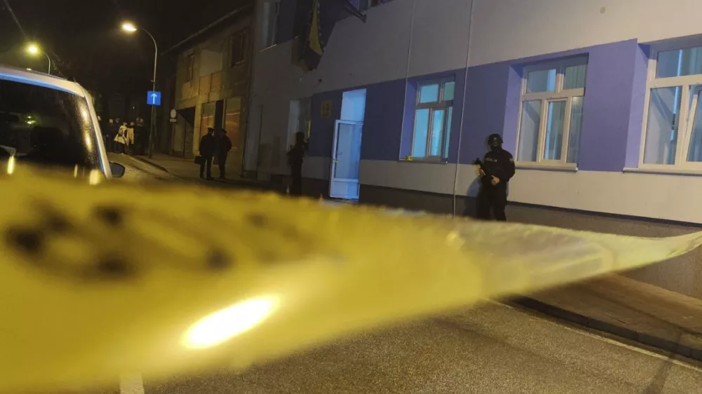 Bosnian police officer guard the local police station after a teenager broke and killed one officer with a knife and wounded another, in the town of Bosanska Krupa, 200 kilometers (120 miles) northwest of Bosnia's capital Sarajevo, Thursday, Oct. 24, 2024. (AP Photo/Edvin Zulic)