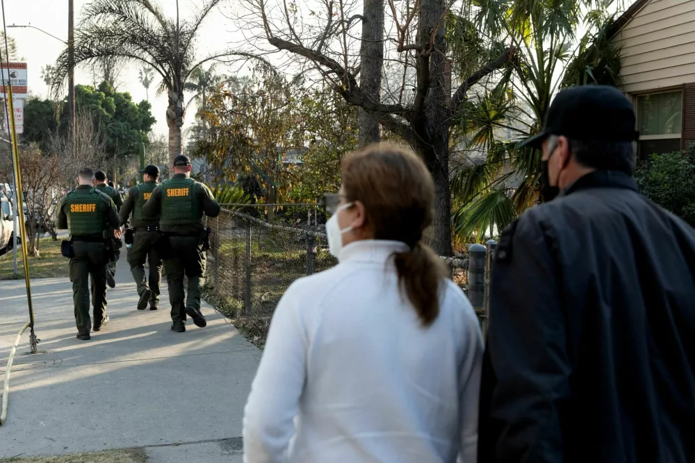 Los Angeles County Sheriff's Department officers patrol the streets to prevent looting in a neighborhood impacted by the Eaton Fire in Altadena, California, U.S. January 9, 2025. REUTERS/Zaydee Sanchez