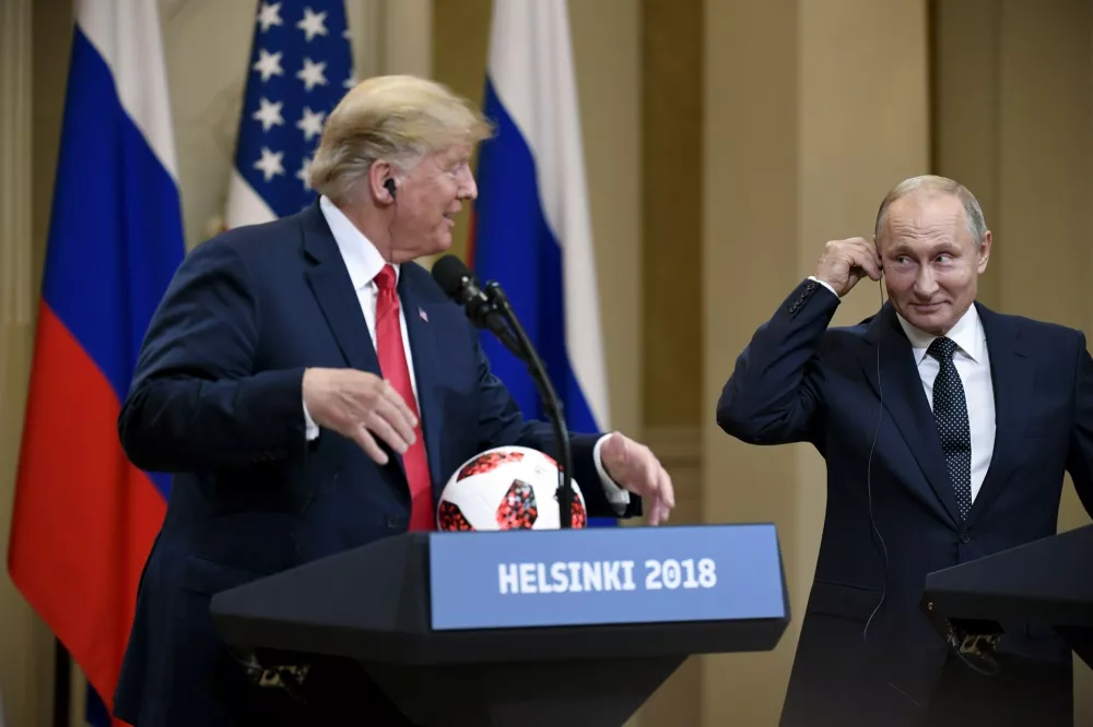 ﻿US President Donald Trump is presenetd with the official game ball of the FIFA World Cup 2018 from Russian President Vladimir Putin (R) during their joint press conference following their meeting at the Finnish Presidential Palace in Helsinki, Finland, 16 July 2018. Photo: Antti Aimo-Koivisto/Lehtikuva/dpa