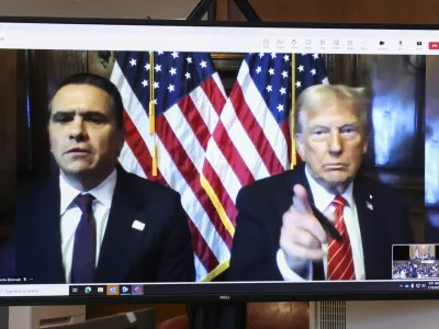 President-elect Donald Trump, right, appears remotely with attorney Todd Blanche for a sentencing hearing in front of New York State Judge Juan Merchan in the criminal case in which he was convicted in 2024 on charges involving hush money paid to a porn star, at New York Criminal Court in New York, Jan. 10, 2025. (Brendan McDermid/Reuters via AP, Pool)