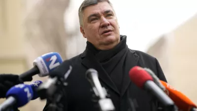 President incumbent Zoran Milanovic talks to media after casting his ballot during a runoff vote for the Croatian presidential election at a polling station in Zagreb, Croatia, Sunday, Jan. 12, 2025. (AP Photo/Darko Bandic)