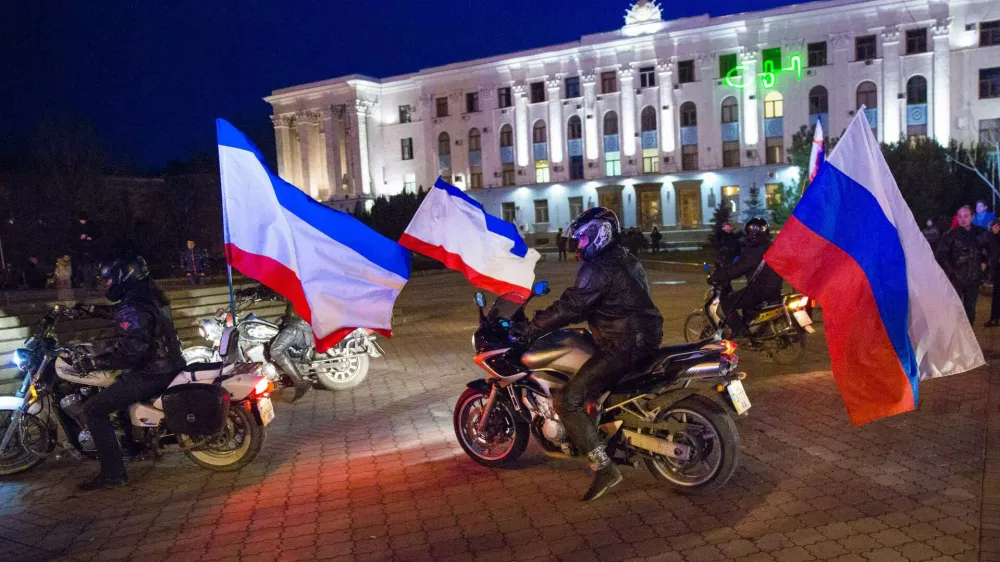 ﻿Motorcyclists have Russian flags attached to their bikes as they arrive on Lenin Square before the announcement of preliminary results of today's referendum on Lenin Square in the Crimean capital of Simferopol, March 16, 2014. Crimeans voted in a referendum on Sunday on whether to break away from Ukraine and join Russia, with Kiev accusing Moscow of pouring forces into the peninsula and warning separatist leaders "the ground will burn under their feet". REUTERS/Thomas Peter (UKRAINE - Tags: POLITICS CIVIL UNREST)