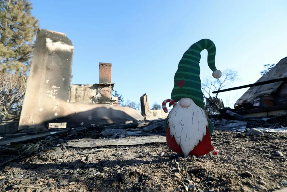 A garden gnome is pictured at the front of a burned home during the Eaton fire in Altadena, California, U.S., January 13, 2025. REUTERS/Mario Anzuoni