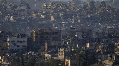 Destroyed buildings are seen inside the Gaza Strip from southern Israel, Monday, Jan. 13, 2025. (AP Photo/Ariel Schalit)