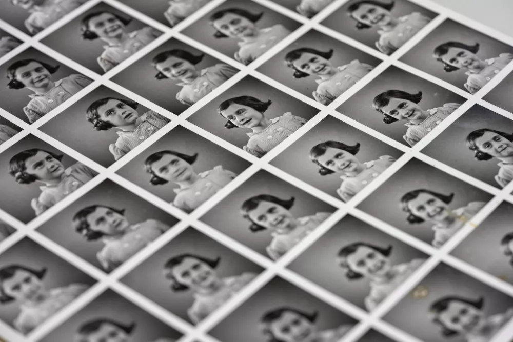 FILE - A sheet of pictures of Anne Frank is displayed in Amsterdam, Netherlands, Oct. 4, 2024. (AP Photo/Peter Dejong, File)