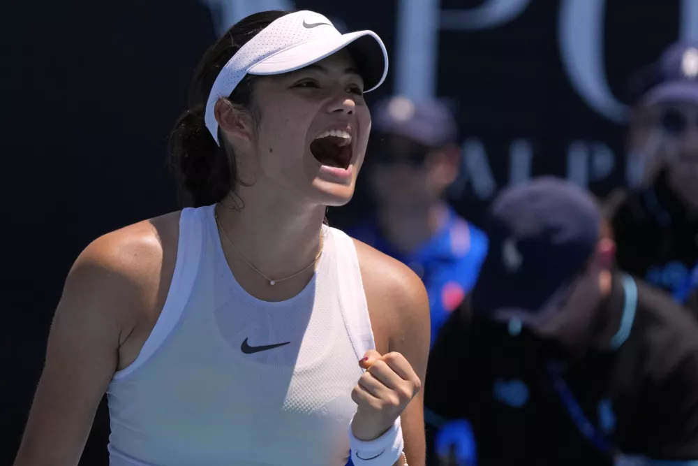 Emma Raducanu of Britain celebrates after defeating Ekaterina Alexandrova of Russia in their first round match at the Australian Open tennis championship in Melbourne, Australia, Tuesday, Jan. 14, 2025. (AP Photo/Manish Swarup)