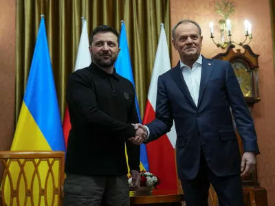 Ukraine's President Volodymyr Zelenskiy and Polish Prime Minister Donald Tusk shake hands as they meet at the Chancellery of the Prime Minister in Warsaw, Poland, January 15, 2025. REUTERS/Aleksandra Szmigiel