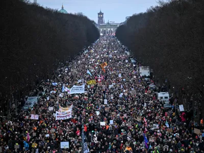 People march during a protest against the migration plans of the CDU party leader and top candidate for chancellor, Friedrich Merz and the far-right Alternative for Germany party (AfD), in Berlin, Germany February 2, 2025. REUTERS/Annegret Hilse