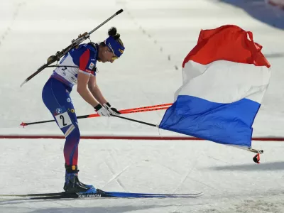 Julia Simon of France celebrates after winning the women's 4x6 km relay race at the Biathlon World World Cup in Nove Mesto na Morave, Czech Republic, Sunday, March 9, 2025. (AP Photo/Petr David Josek)