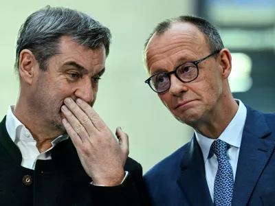 FILE PHOTO: Germany's chancellor-in-waiting and leader of the Christian Democratic Union party (CDU) Friedrich Merz speaks with Bavarian state premier and leader of the Christian Social Union (CSU) Markus Soeder as they give a statement with co-leaders of the Social Democratic party (SPD) Saskia Esken and Lars Klingbeil, after exploratory talks in Berlin, Germany March 8, 2025. REUTERS/Annegret Hilse/File Photo