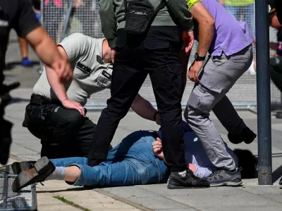 FILE PHOTO: A person is detained after shooting incident of Slovak PM Robert Fico, after a Slovak government meeting in Handlova, Slovakia, May 15, 2024. REUTERS/Radovan Stoklasa/File Photo