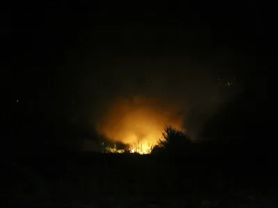 Flames are seen at the site of a plane crash, a few miles away from the city of Kavala, in northern Greece, Saturday, July 16, 2022. An Antonov cargo plane operated by a Ukraine-based air carrier crashed Saturday near the city of Kavala in northern Greece, authorities said. Greek Civil Aviation authorities say the flight was heading from Serbia to Jordan, but have not been able to confirm how many people were on board or what the plane's cargo was. (Ilias Kotsireas/InTime News via AP)