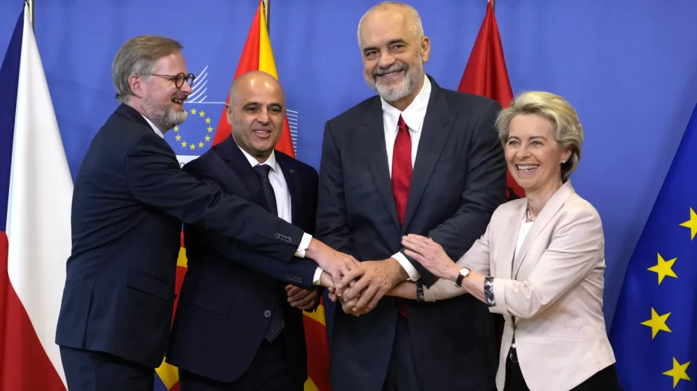 From right, European Commission President Ursula von der Leyen, Albanian Prime Minister Edi Rama, North Macedonia's Prime Minister Dimitar Kovacevski and Czech Republic's Prime Minister Petr Fiala shake hands prior to a meeting at EU headquarters in Brussels, Tuesday, July 19, 2022. The European Union on Tuesday is starting the long enlargement process that aims to lead to the membership of Albania and North Macedonia in the bloc. (AP Photo/Virginia Mayo)