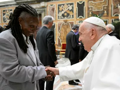 Pope Francis greets Whoopi Goldberg as he meets with comedians during a cultural event at the Vatican, June 14, 2024. Vatican Media/­Handout via REUTERS  ATTENTION EDITORS - THIS IMAGE WAS PROVIDED BY A THIRD PARTY. BEST QUALITY AVAILABLE.