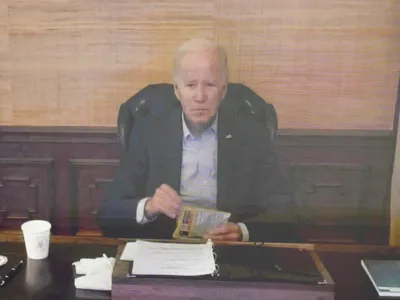 FILE - President Joe Biden virtually attends a meeting with his economic team in the South Court Auditorium on the White House complex in Washington, Friday, July 22, 2022. Biden's condition continues to improve since testing positive for the coronavirus, and he likely contracted a highly contagious variant that has been spreading rapidly through the United States, according to an update from his doctor on Saturday, July 23. (AP Photo/Andrew Harnik, File)