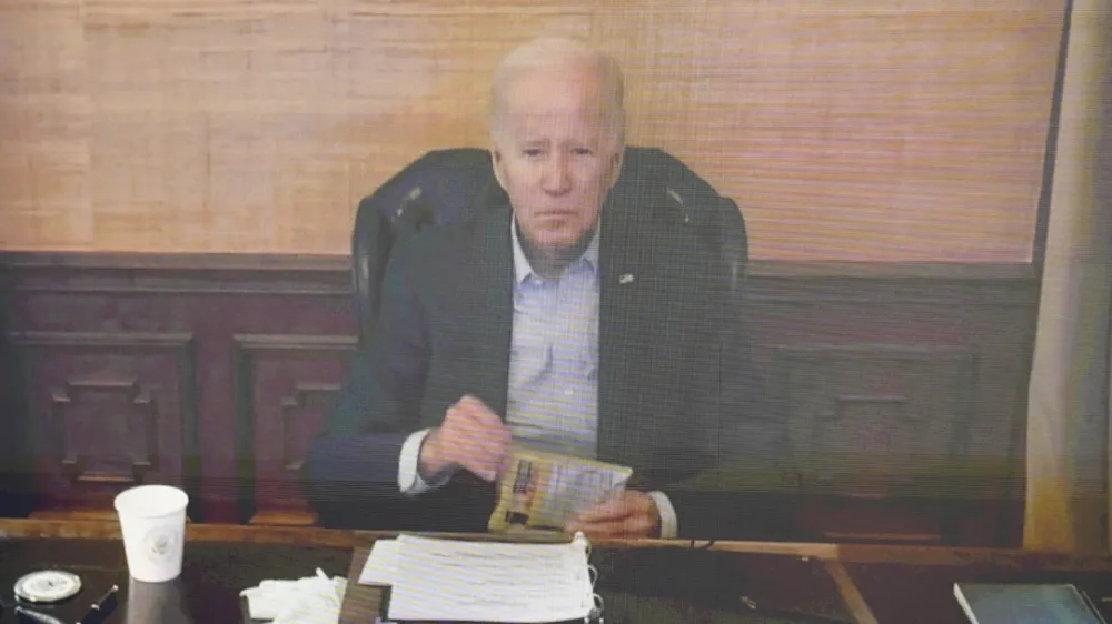 FILE - President Joe Biden virtually attends a meeting with his economic team in the South Court Auditorium on the White House complex in Washington, Friday, July 22, 2022. Biden's condition continues to improve since testing positive for the coronavirus, and he likely contracted a highly contagious variant that has been spreading rapidly through the United States, according to an update from his doctor on Saturday, July 23. (AP Photo/Andrew Harnik, File)