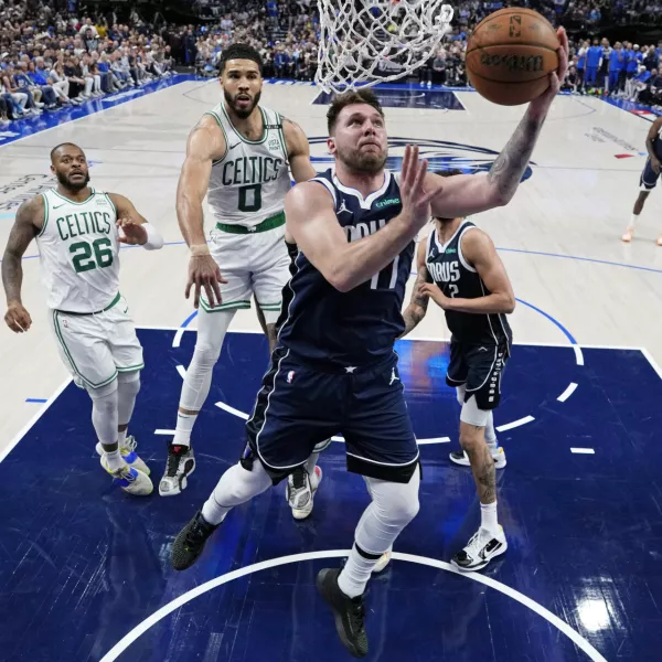 Jun 12, 2024; Dallas, Texas, USA; Dallas Mavericks guard Luka Doncic (77) goes up for a basket against Boston Celtics forward Jayson Tatum (0) during the second half during game three of the 2024 NBA Finals at American Airlines Center. Mandatory Credit: Julio Cortez/Pool Photo-USA TODAY Sports