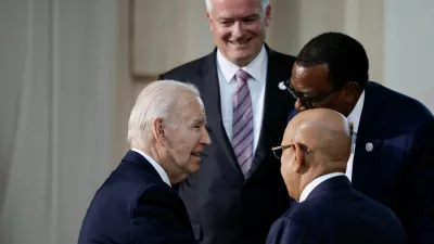 U.S. President Joe Biden, African Development Bank President Akinwumi Adesina, and OECD Secretary General Mathias Cormann stand together, on the second day of the G7 summit at the Borgo Egnazia resort, in Savelletri, Italy June 14, 2024. REUTERS/Louisa Gouliamaki