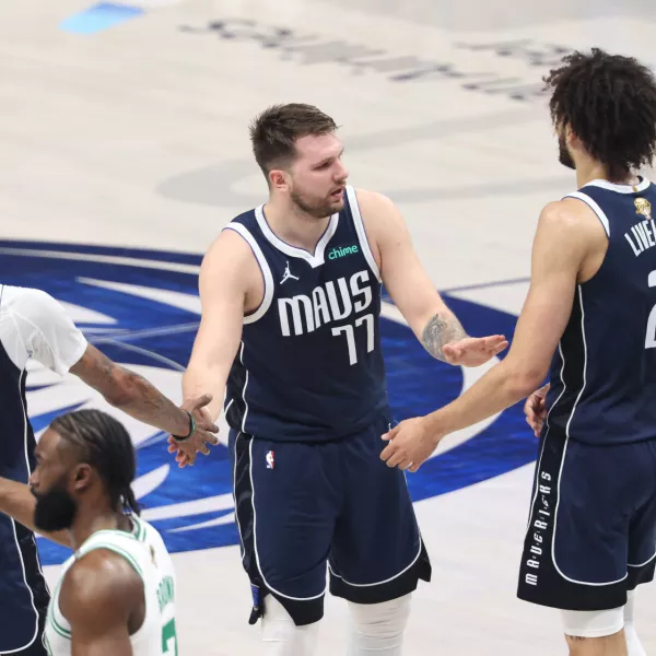 Jun 14, 2024; Dallas, Texas, USA; Dallas Mavericks guard Luka Doncic (77) high fives center Dereck Lively II (2) and forward Derrick Jones Jr. (55) during the first quarter against the Boston Celtics during game four of the 2024 NBA Finals at American Airlines Center. Mandatory Credit: Kevin Jairaj-USA TODAY Sports