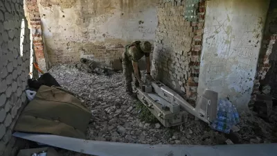 A Ukrainian serviceman of the 148th Separate Artillery Brigade of the Ukrainian Air Assault Forces, assembles an American reconnaissance drone RQ-20 «Puma» for flying over positions of Russian troops, amid Russia's attack on Ukraine, in Donetsk region, Ukraine June 13, 2024. REUTERS/Stringer