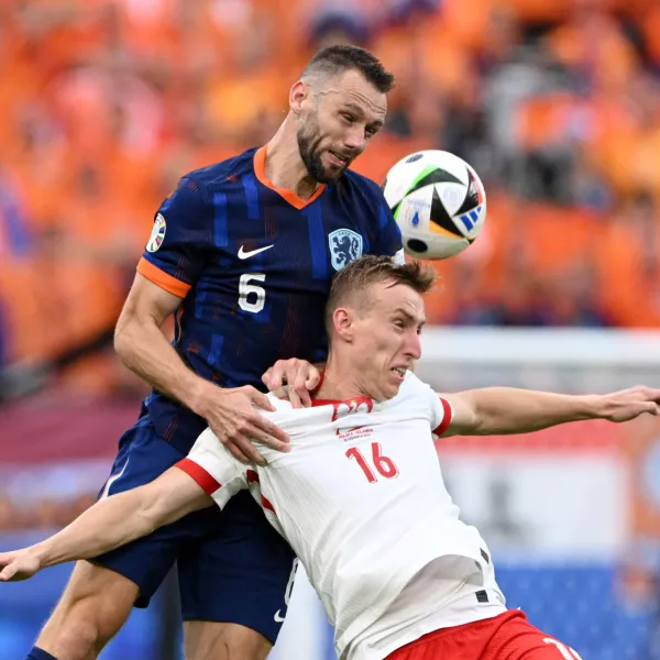 Soccer Football - Euro 2024 - Group D - Poland v Netherlands - Hamburg Volksparkstadion, Hamburg, Germany - June 16, 2024 Netherlands' Stefan de Vrij in action with Poland's Adam Buksa REUTERS/Annegret Hilse