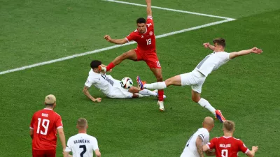 Soccer Football - Euro 2024 - Group C - Slovenia v Denmark - Stuttgart Arena, Stuttgart, Germany - June 16, 2024 Slovenia's Jaka Bijol in action with Denmark's Alexander Bah REUTERS/Leonhard Simon