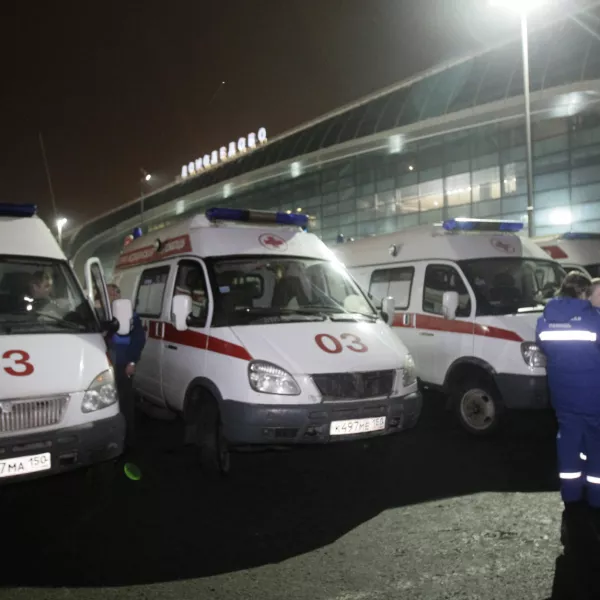 Ambulances are seen outside a terminal at Domodedovo airport, Moscow, Monday, Jan. 24, 2011. An explosion ripped through the international arrivals hall at Moscow's busiest airport on Monday, killing dozens of people and wounding scores, officials said. The Russian president called it a terror attack. (AP Photo/Ivan Sekretarev)