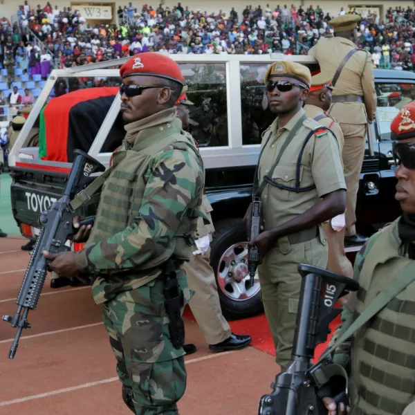 Members of the military keep watch near the casket carrying the body of the late Vice President of Malawi, Saulos Klaus Chilima, after lying-in-state at Bingu National Stadium, as mourning Malawians gather in the capital Lilongwe, in Malawi, June 16, 2024. REUTERS/Eldson Chagara