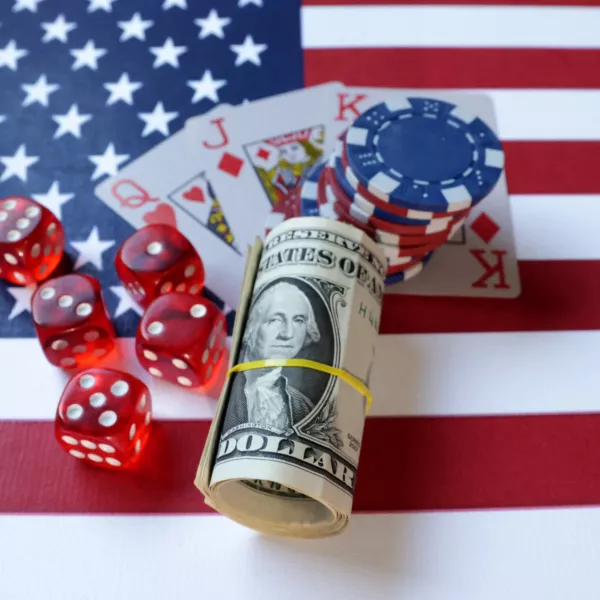 Cards, gambling dices, U.S. dollar banknotes and U.S. flag are seen in this illustration taken, June 17, 2024. REUTERS/Dado Ruvic/Illustration