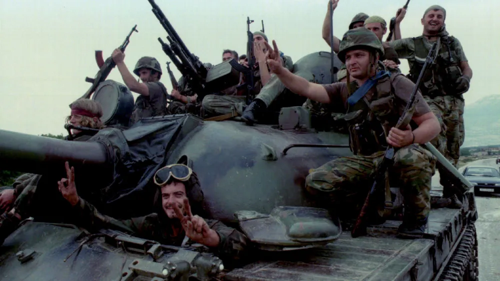 Jubilant Croatian Army troops ride into the captured city of Knin on top of a tank August 5, after a lightning offensive codenamed Operation Thunderstorm caused rebel Serb resistance to crumble. The Bosnian Army's 5th Corps in besieged Bihac also rolled five kilometres into Serb held territory to link with allied Croat forces, effectively ending their three years of isolation.<br>??? OUT - PBEAHUNCTCG