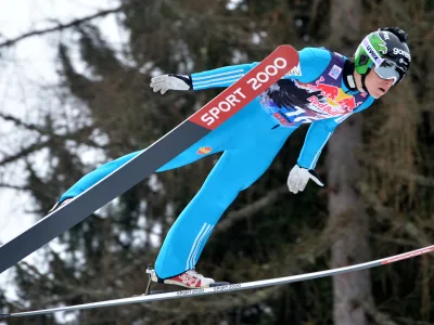 Slovenia's Jurij Tepes soars during the trial jump of the Ski Jumping World Cup in Bad Mitterndorf, Austria, on Friday, Jan. 9, 2015. (AP Photo/Kerstin Joensson) 