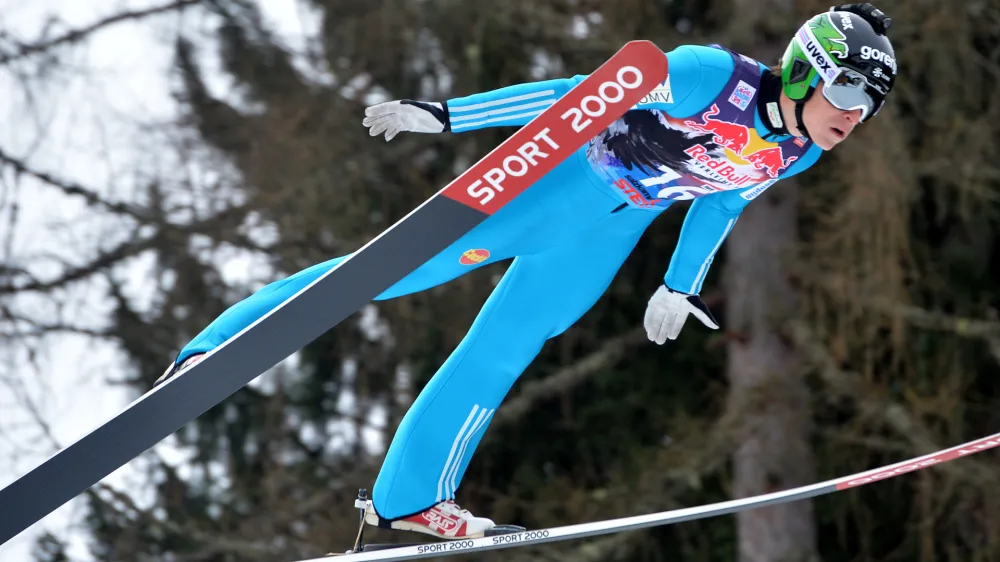 Slovenia's Jurij Tepes soars during the trial jump of the Ski Jumping World Cup in Bad Mitterndorf, Austria, on Friday, Jan. 9, 2015. (AP Photo/Kerstin Joensson) 