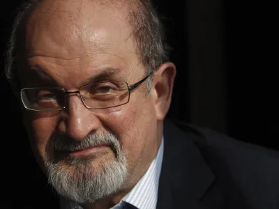 Author Salman Rushdie poses for a photograph after an interview with Reuters in central London in this October 8, 2010 file photo. The Jaipur Literature Festival, Asia's largest literature festival, cancelled a televised speech by Salman Rushdie minutes before it was scheduled to begin on January 24, 2012 amid death threats to its organiser and fears of violent protests at the event by Muslim groups. REUTERS/Andrew Winning/Files (BRITAIN - Tags: ENTERTAINMENT HEADSHOT SOCIETY PROFILE RELIGION)