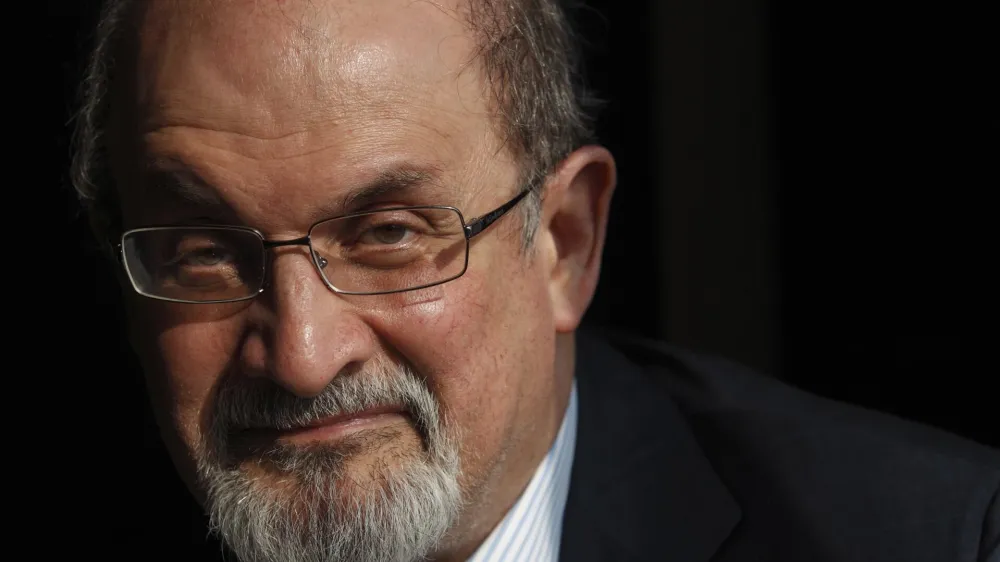 Author Salman Rushdie poses for a photograph after an interview with Reuters in central London in this October 8, 2010 file photo. The Jaipur Literature Festival, Asia's largest literature festival, cancelled a televised speech by Salman Rushdie minutes before it was scheduled to begin on January 24, 2012 amid death threats to its organiser and fears of violent protests at the event by Muslim groups. REUTERS/Andrew Winning/Files (BRITAIN - Tags: ENTERTAINMENT HEADSHOT SOCIETY PROFILE RELIGION)