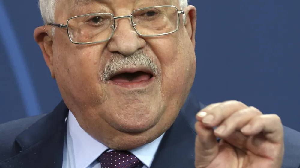 Palestinian President Mahmoud Abbas speaks during a news conference after a meeting with German Chancellor Olaf Scholz at the Chancellery in Berlin, Tuesday, Aug. 16, 2022. German Chancellor Olaf Scholz said on Wednesday, Aug. 17, 2022, that "For us Germans in particular, any relativization of the singularity of the Holocaust is intolerable and unacceptable. I condemn any attempt to deny the crimes of the Holocaust." (Wolfgang Kumm/dpa via AP)