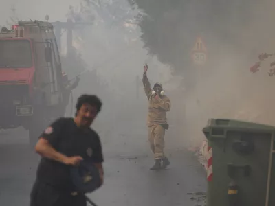 Firefighters operate during a wildfire in Voula suburb, in southern Athens, Greece, Saturday, June 4, 2022. A combination of hot, dry weather and strong winds makes Greece vulnerable to wildfire outbreaks every summer. (AP Photo/Yorgos Karahalis)