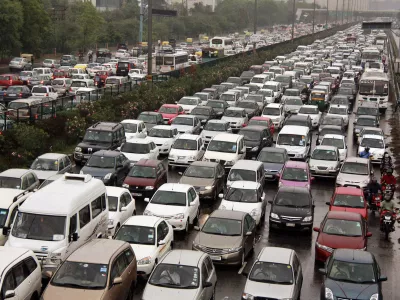 A traffic jam following power outage and rains at the Delhi-Gurgaon road on the outskirts of New Delhi, India, Tuesday, July 31, 2012. India's energy crisis cascaded over half the country Tuesday when three of its regional grids collapsed, leaving 620 million people without government-supplied electricity in one of the world's biggest-ever blackouts. (AP Photo)