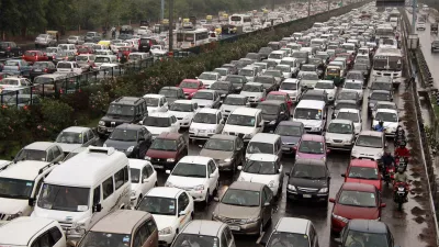 A traffic jam following power outage and rains at the Delhi-Gurgaon road on the outskirts of New Delhi, India, Tuesday, July 31, 2012. India's energy crisis cascaded over half the country Tuesday when three of its regional grids collapsed, leaving 620 million people without government-supplied electricity in one of the world's biggest-ever blackouts. (AP Photo)