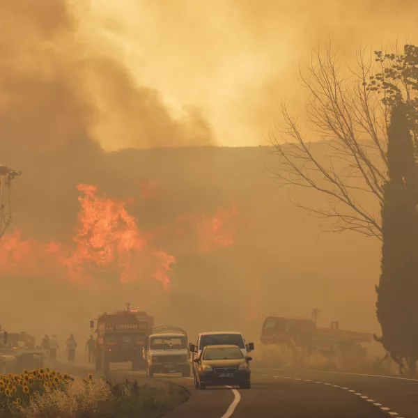 Firefighters work to extinguish a fire burning near Kumkoy, in Gallipoli peninsula, Turkey, Tuesday, June 18, 2024. (Sercan Ozkurnazli/Dia Photo via AP)