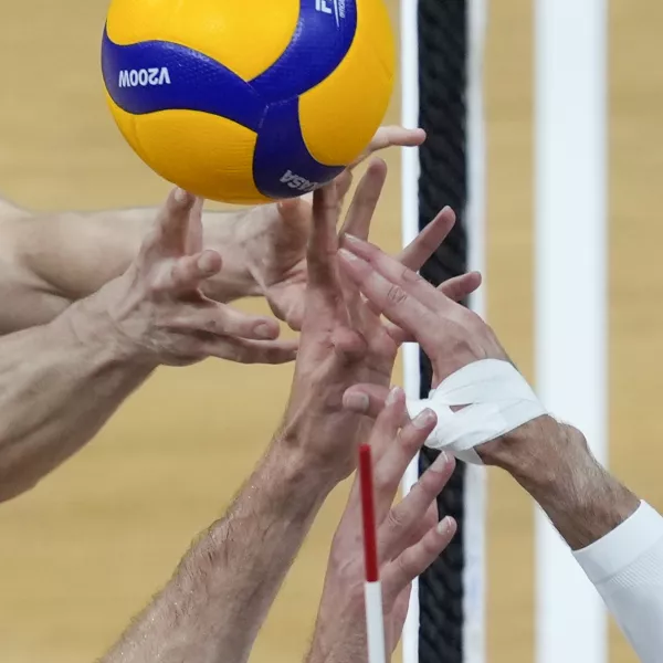 Kevin Tillie, right, of France, tries control the ball against Tobias Brand, left, and Tobias Krick, of Germany during their Volleyball Men's Nations League match at the Mall of Asia Arena in Manila, Philippines on Wednesday, June 19, 2024. (AP Photo/Aaron Favila)