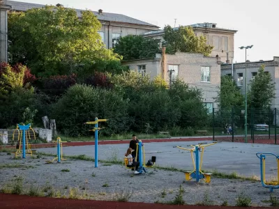 People spend the evening on a playground near a city park, amid Russia's attack on Ukraine, in Kramatorsk, June 21, 2024. REUTERS/Alina Smutko