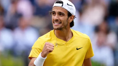 22 June 2024, United Kingdom, London: Italian tennis player Lorenzo Musetti celebrates defeating Australia's Jordan Thompson on day eight of the cinch Championships at The Queen's Club. Photo: Zac Goodwin/PA Wire/dpa