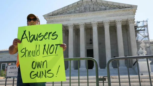 Rev. Patrick Mahoney, director of the Christian Defense Coalition, holds up a sign after U.S. justices rejected a Second Amendment challenge to a federal law that makes it a crime for people subject to domestic violence restraining orders to possess a gun, outside the U.S. Supreme Court in Washington, U.S., June 21, 2024. REUTERS/Amanda Andrade-Rhoades