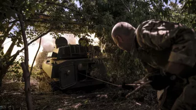 In this photo provided by Ukraine's 24th Mechanised Brigade press service, a soldier fires a "Gvozdika" 120mm Soviet-made howitzer towards Russian positions at outskirts of Chasiv Yar, Donetsk region, Ukraine, Saturday, June 22, 2024, (Oleg Petrasiuk/Ukraine's 24th Mechanised Brigade via AP)